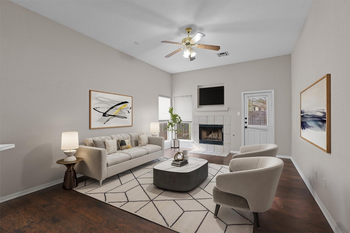 154 Meadowlark Circle Georgetown, TX 78626 - Photo 6 of 29 a living room with furniture chandelier and a fireplace