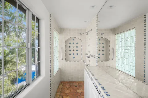 a bathroom with a bathtub and shower