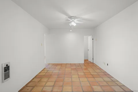 a kitchen with a stove top oven and cabinets