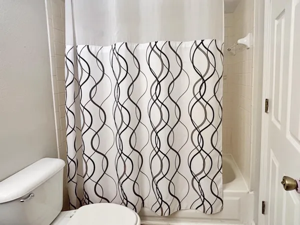 a bathroom with a toilet and a sink