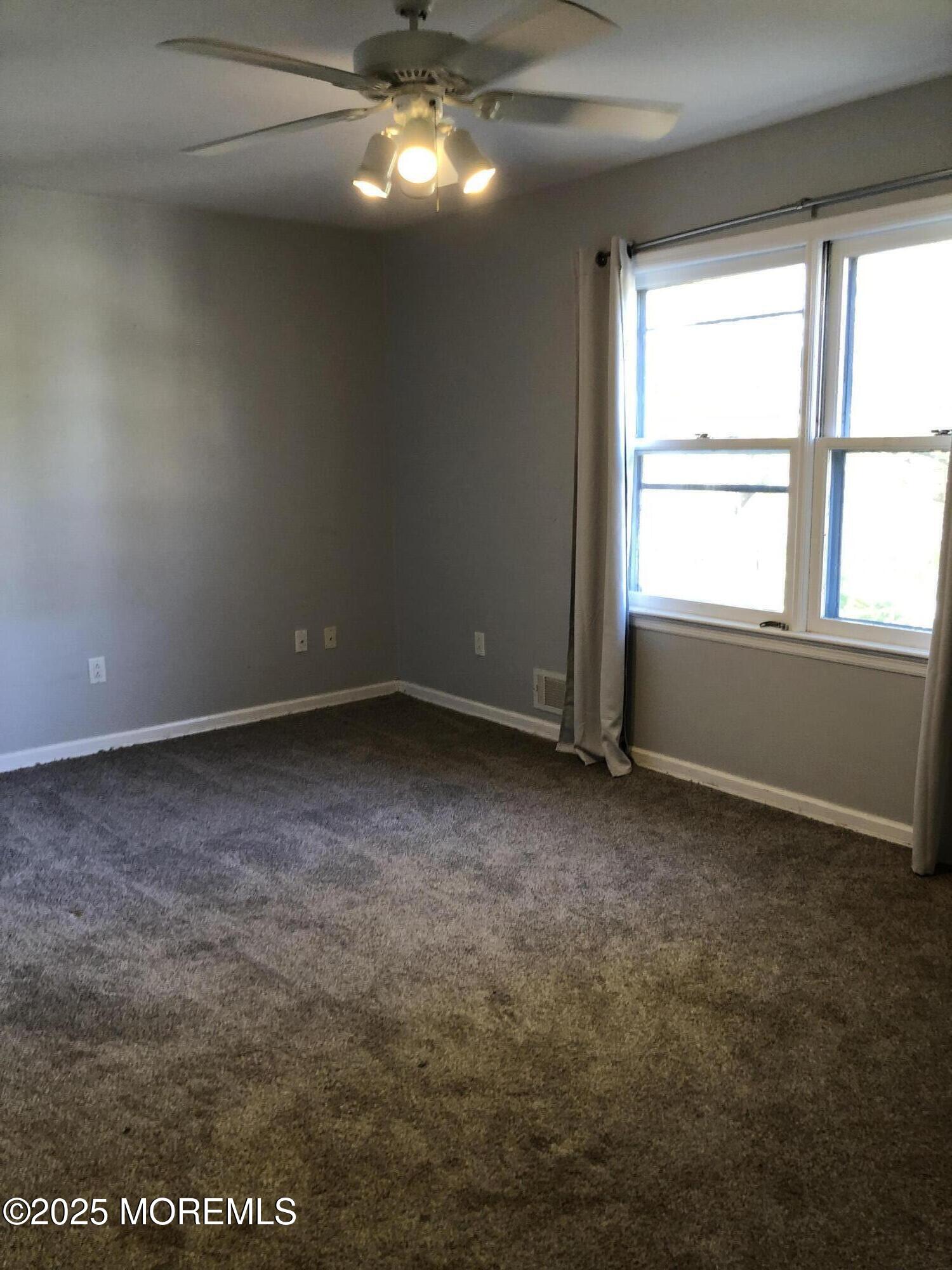 683 Princess Court Toms River, NJ 08753 - Photo 16 of 22 an empty room with a empty space and windows