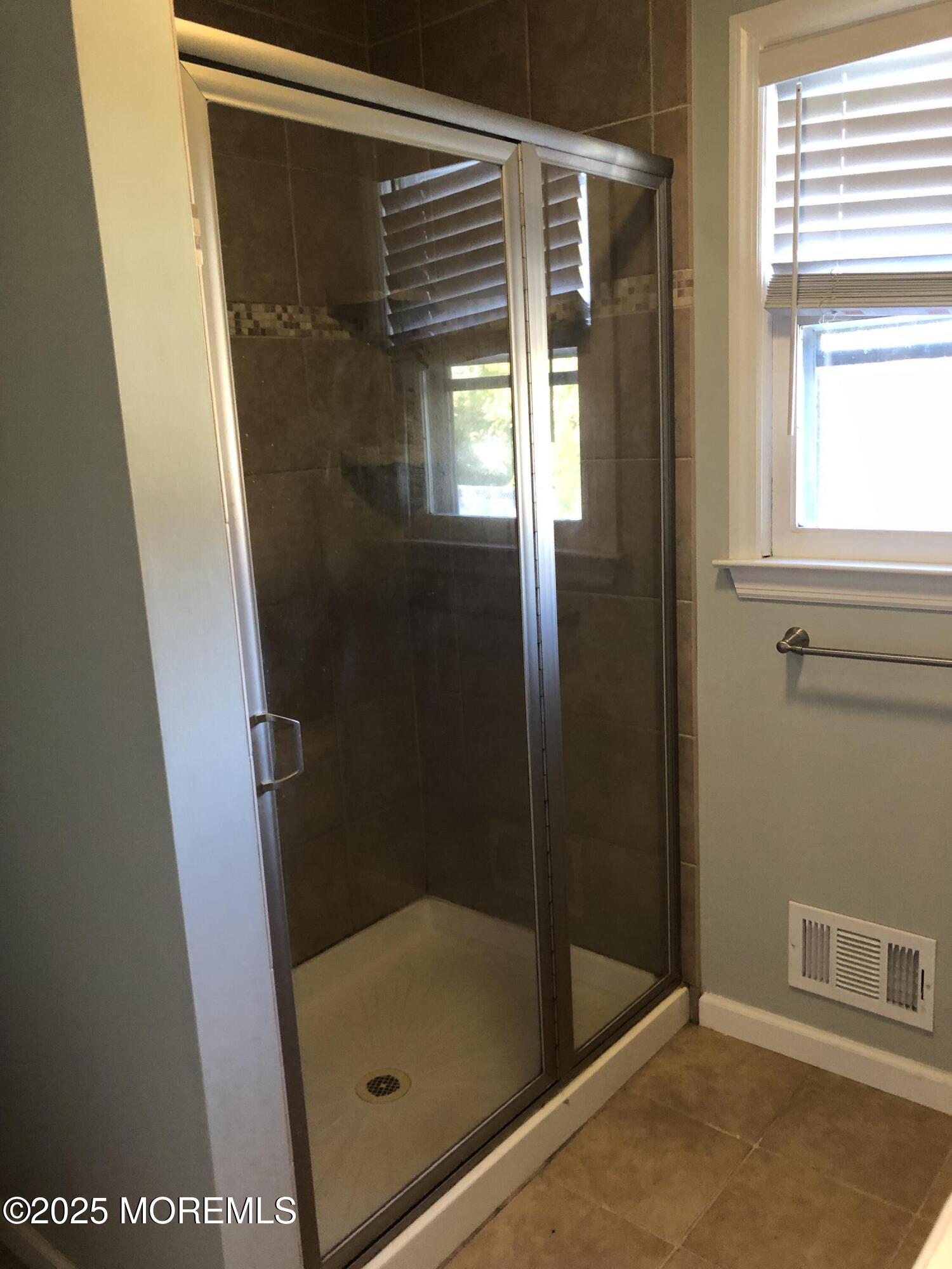 683 Princess Court Toms River, NJ 08753 - Photo 18 of 22 a bathroom with a glass shower door