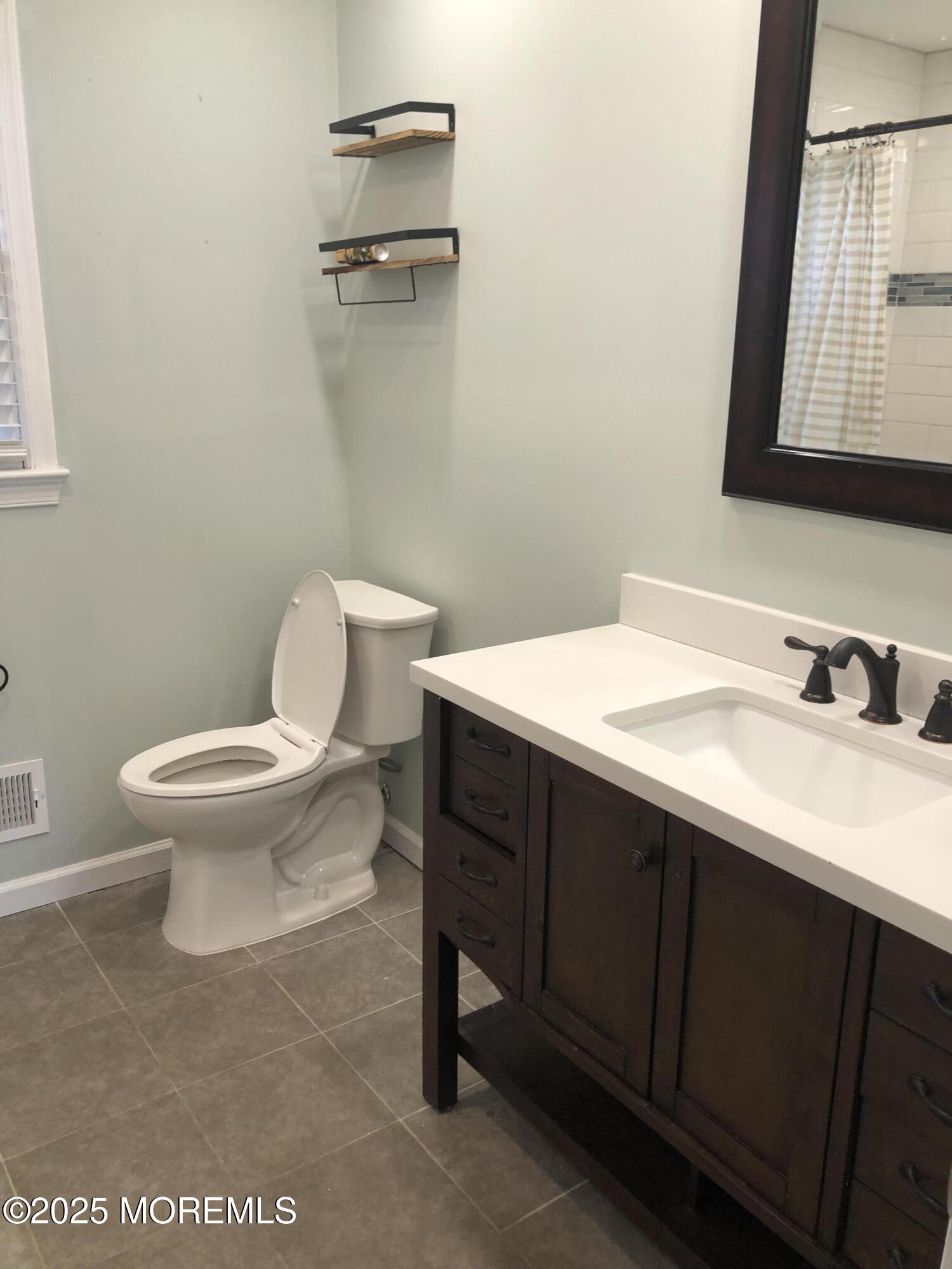 683 Princess Court Toms River, NJ 08753 - Photo 22 of 22 a bathroom with a sink and a toilet