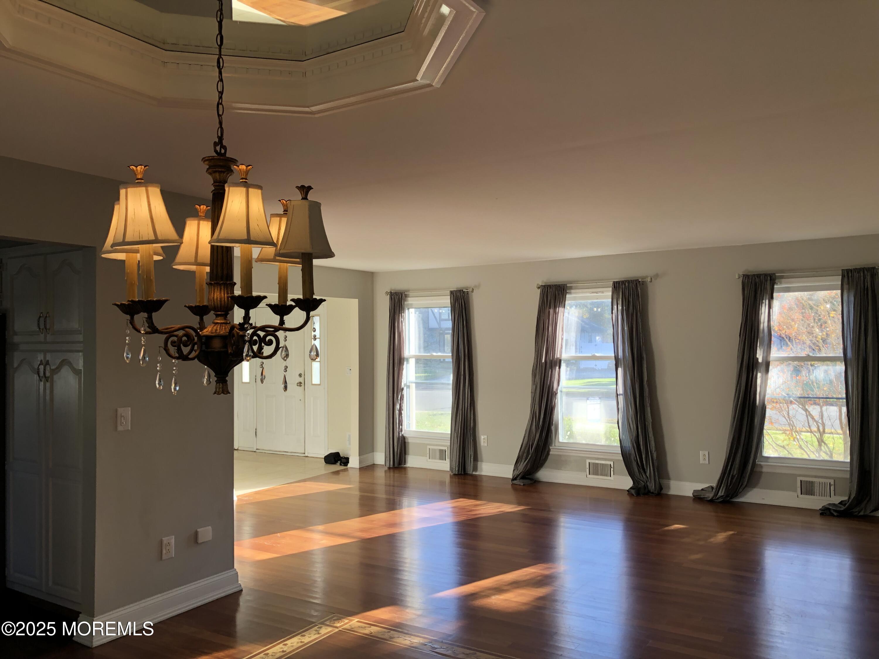 683 Princess Court Toms River, NJ 08753 - Photo 4 of 22 a view of a living room with hardwood floor and windows