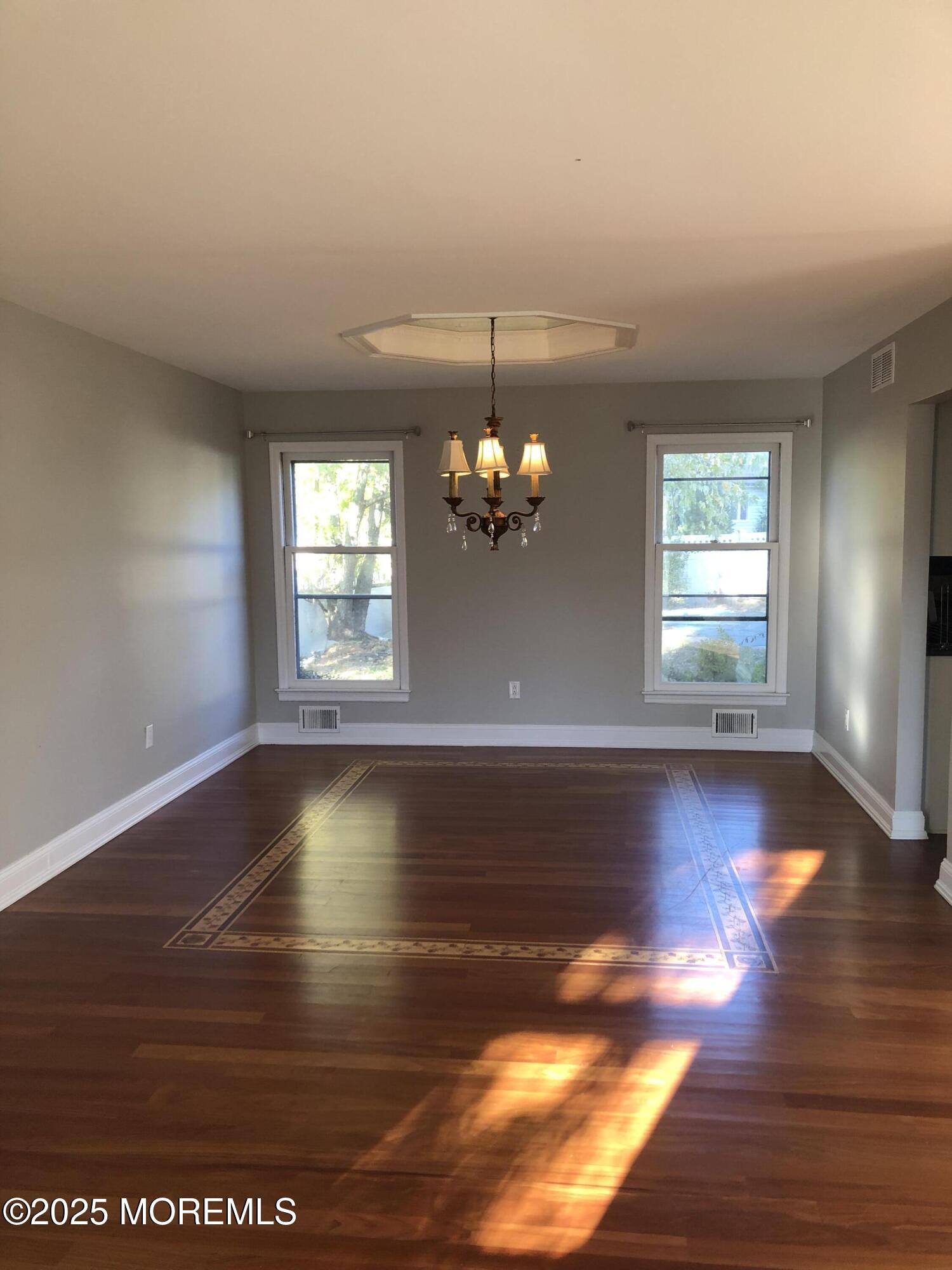 683 Princess Court Toms River, NJ 08753 - Photo 5 of 22 a view of a room with window and wooden floor