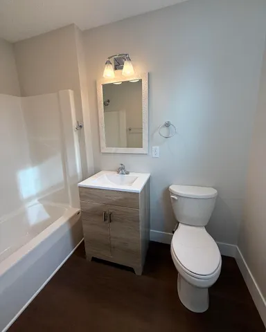 a bathroom with a sink toilet and a bathtub