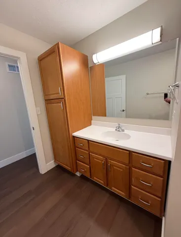 a bathroom with a double vanity sink and mirror