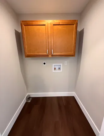 a view of room with wooden floor and a window