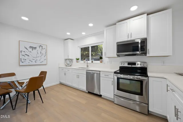 a view of entryway with wooden floor and stairs