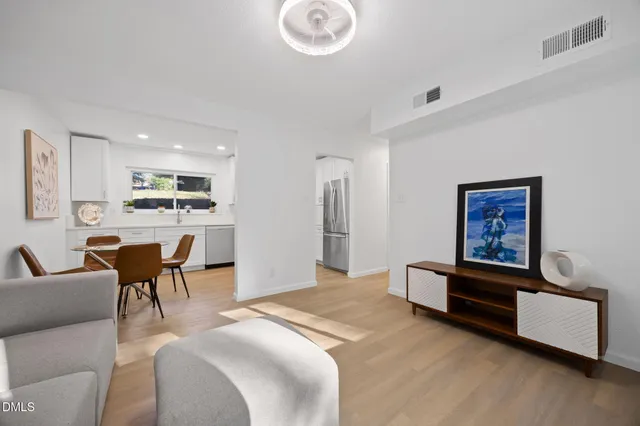 a kitchen with a sink cabinets and stainless steel appliances