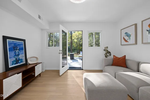 a living room with furniture and a table