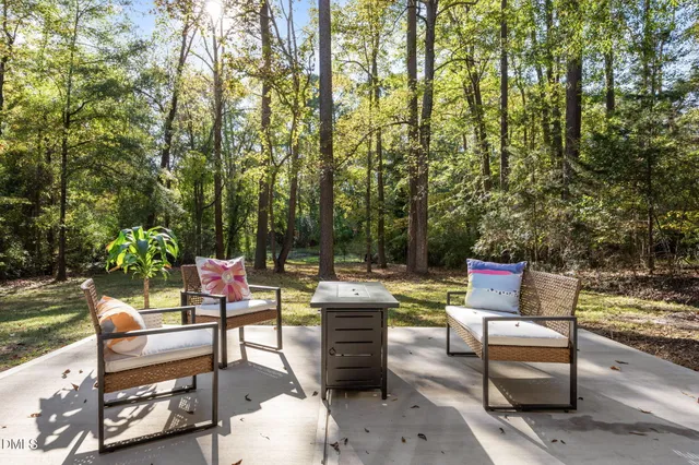 a bedroom with furniture and a large window