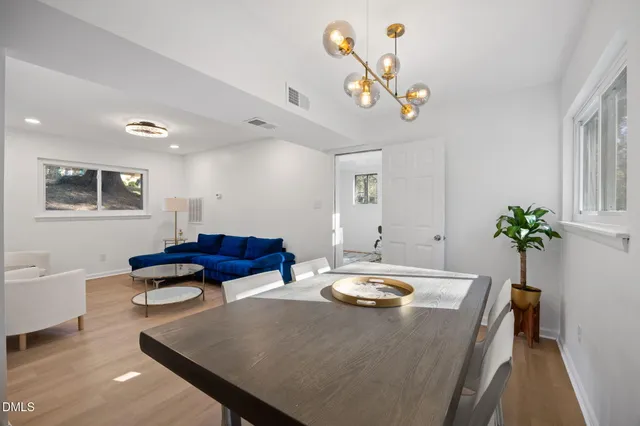 a living room with furniture a couch and a lamp