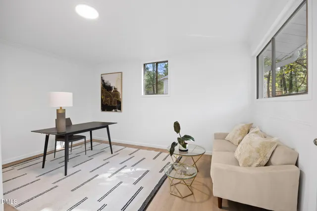 a view of a dining room with furniture and window