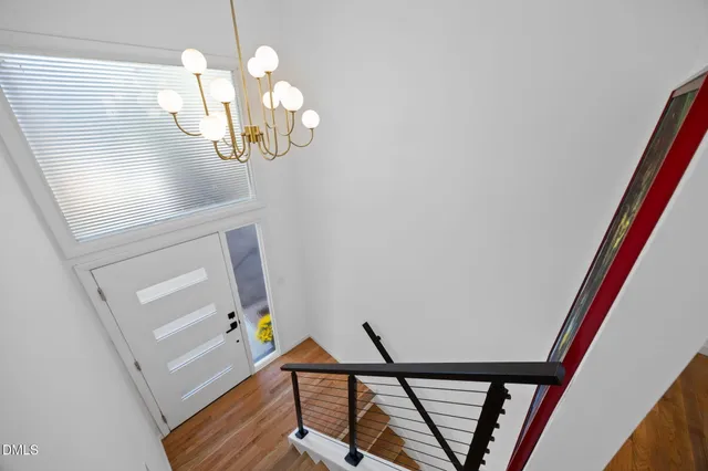 a living room with furniture rug and window