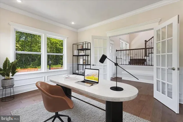 a kitchen with a sink a table and chairs
