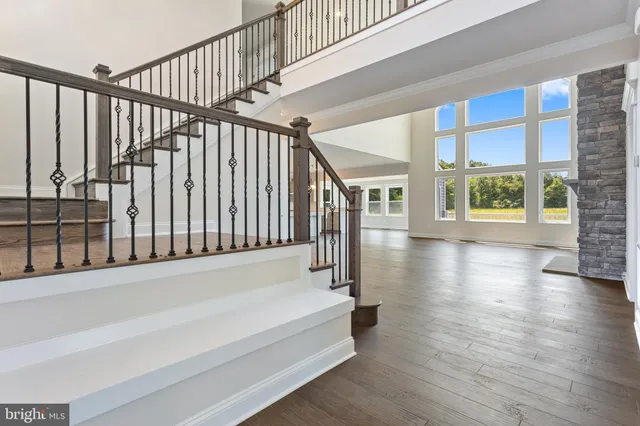 a view of staircase with white walls and windows