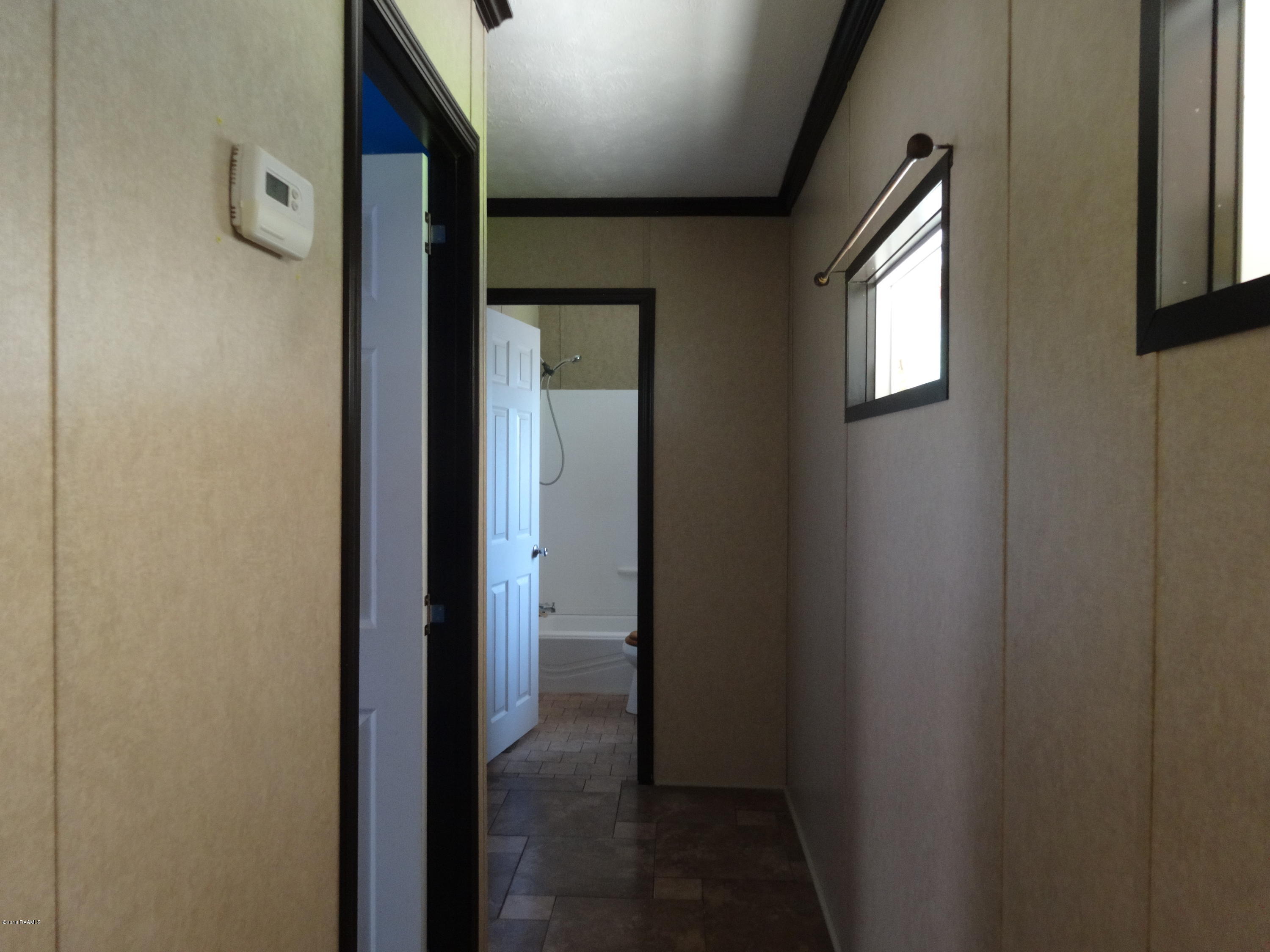201 La Rue Rhiems Duson, LA 70529 - Photo 15 of 23 Hallway to Guest Bedrooms