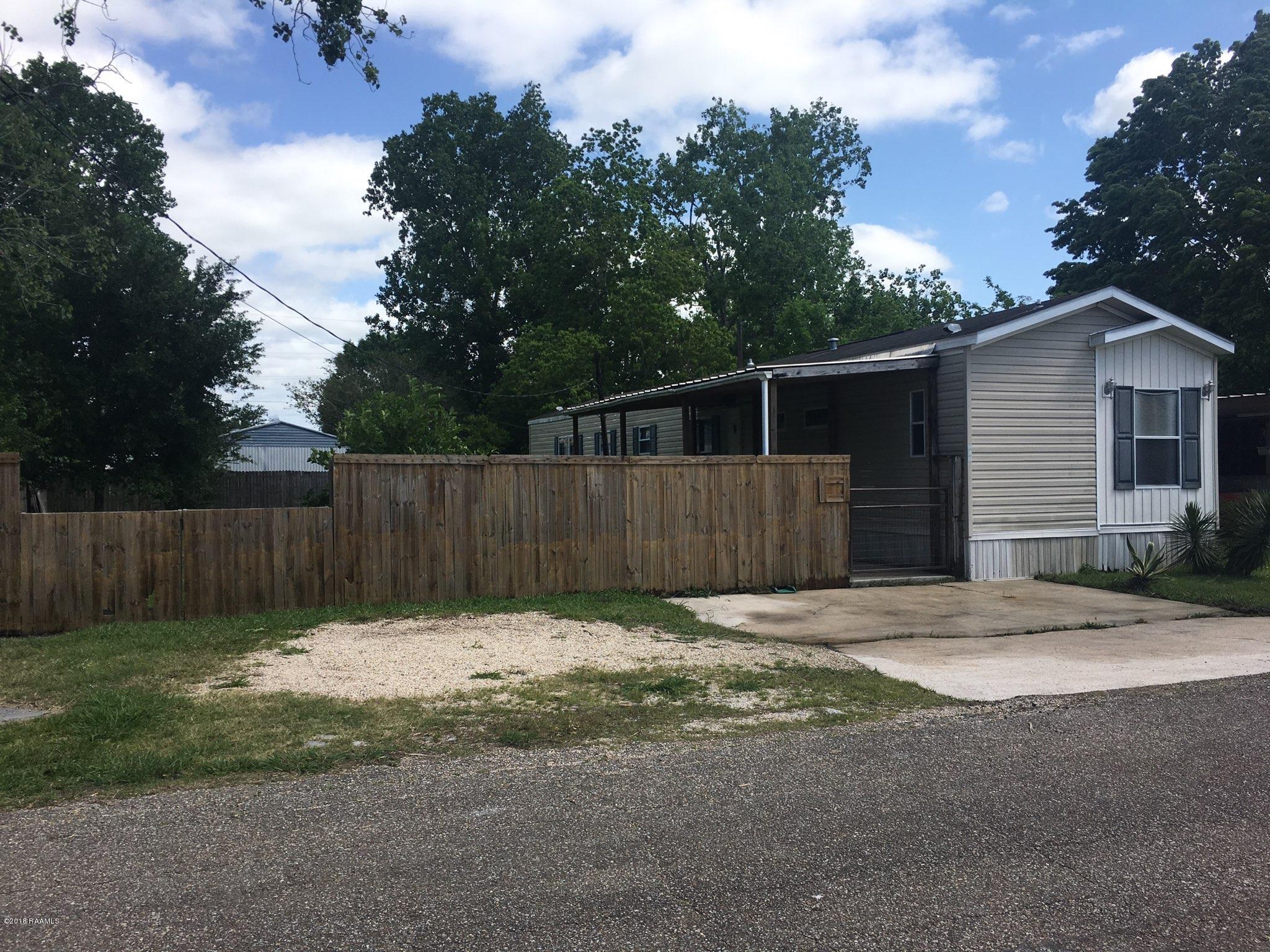 201 La Rue Rhiems Duson, LA 70529 - Photo 23 of 23 Road view with fencing