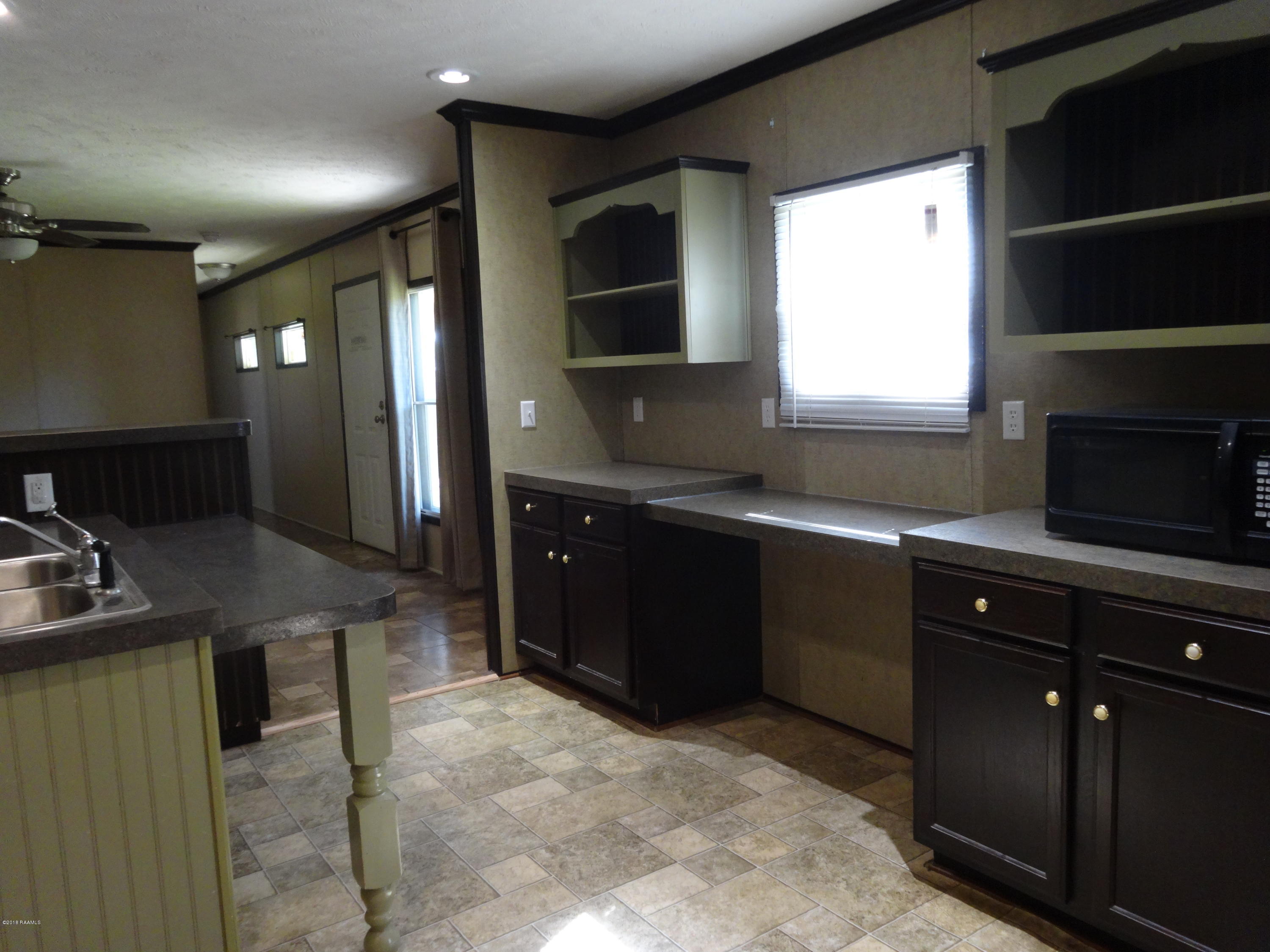 201 La Rue Rhiems Duson, LA 70529 - Photo 8 of 23 Cabinetry & Desk Area