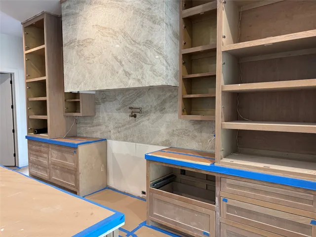 a kitchen with stainless steel appliances a sink and a stove