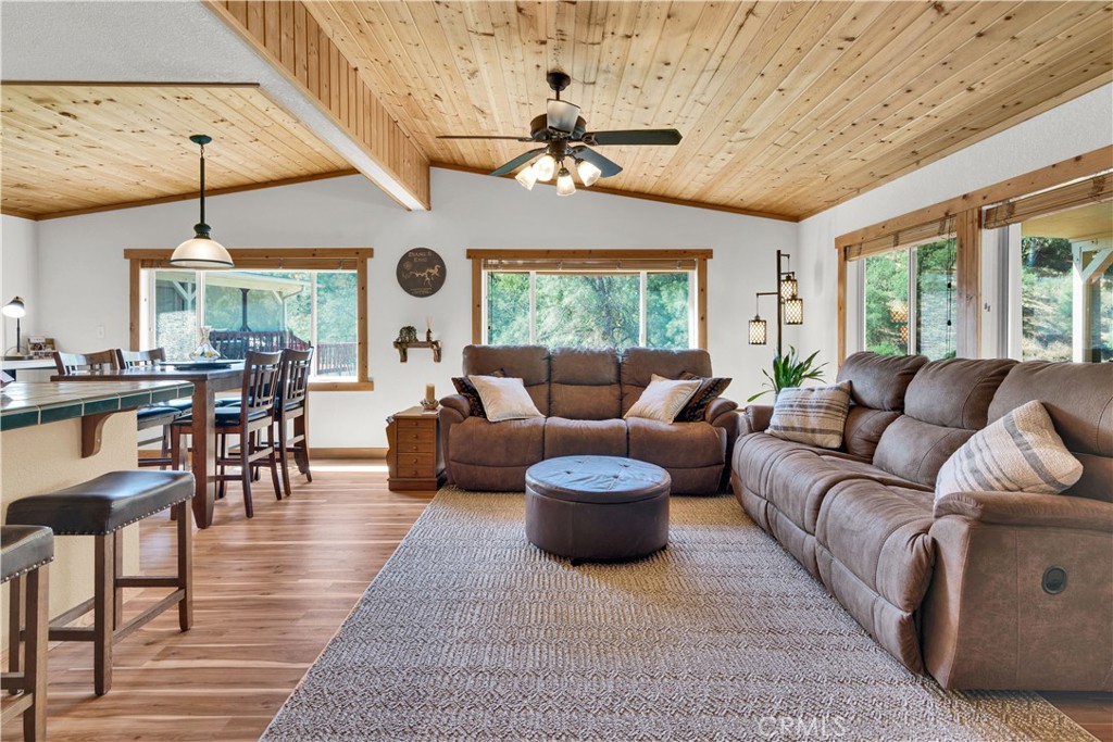 4653 Green Pine Lane Paso Robles, CA 93446 - Photo 11 of 36 a living room with furniture a chandelier and a large window