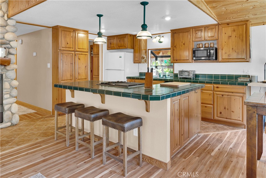 4653 Green Pine Lane Paso Robles, CA 93446 - Photo 14 of 36 a kitchen with stainless steel appliances granite countertop a sink and cabinets