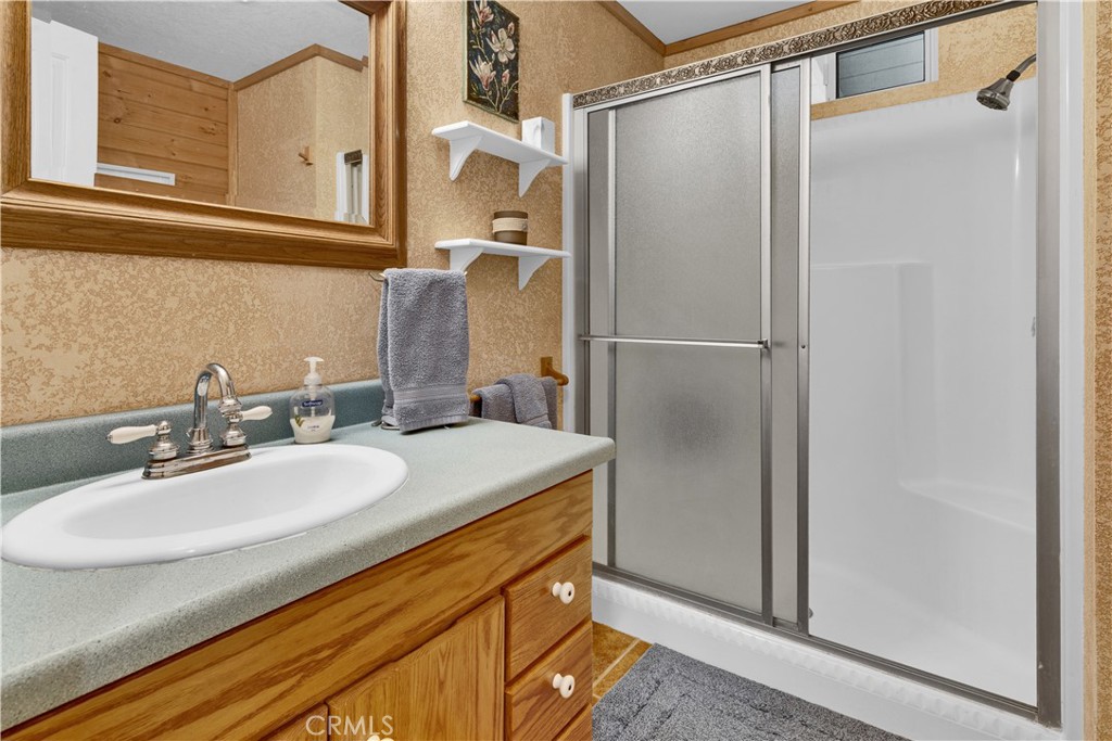 4653 Green Pine Lane Paso Robles, CA 93446 - Photo 27 of 36 a bathroom with a sink and mirror