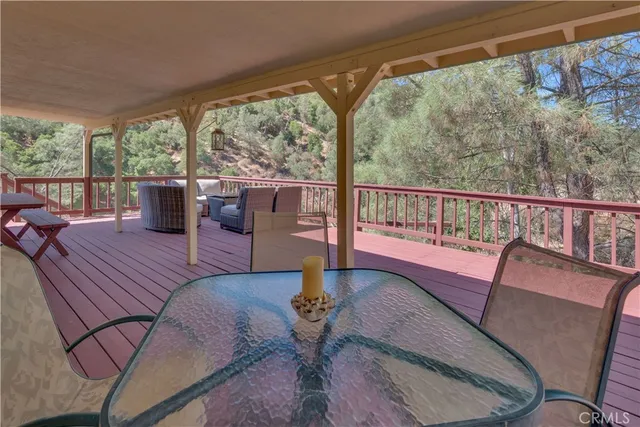 a view of a living room with furniture window and wooden floor