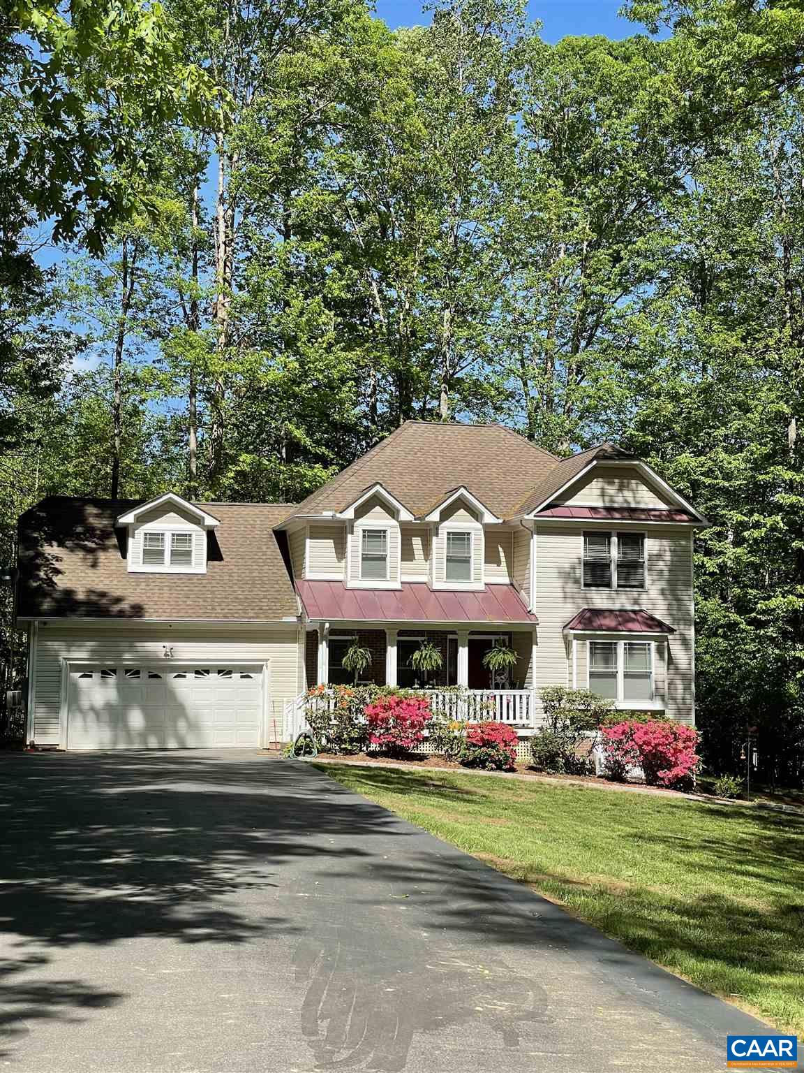 6444 Spring Hill Road Ruckersville, VA 22968 - Photo 1 of 31 a front view of a house with a garden