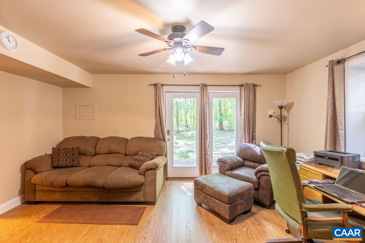 6444 Spring Hill Road Ruckersville, VA 22968 - Photo 20 of 31 a living room with furniture and a large window