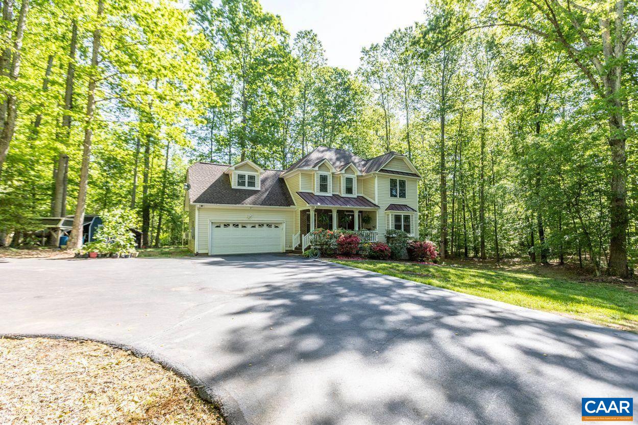 6444 Spring Hill Road Ruckersville, VA 22968 - Photo 2 of 31 a front view of a house with a yard and garage