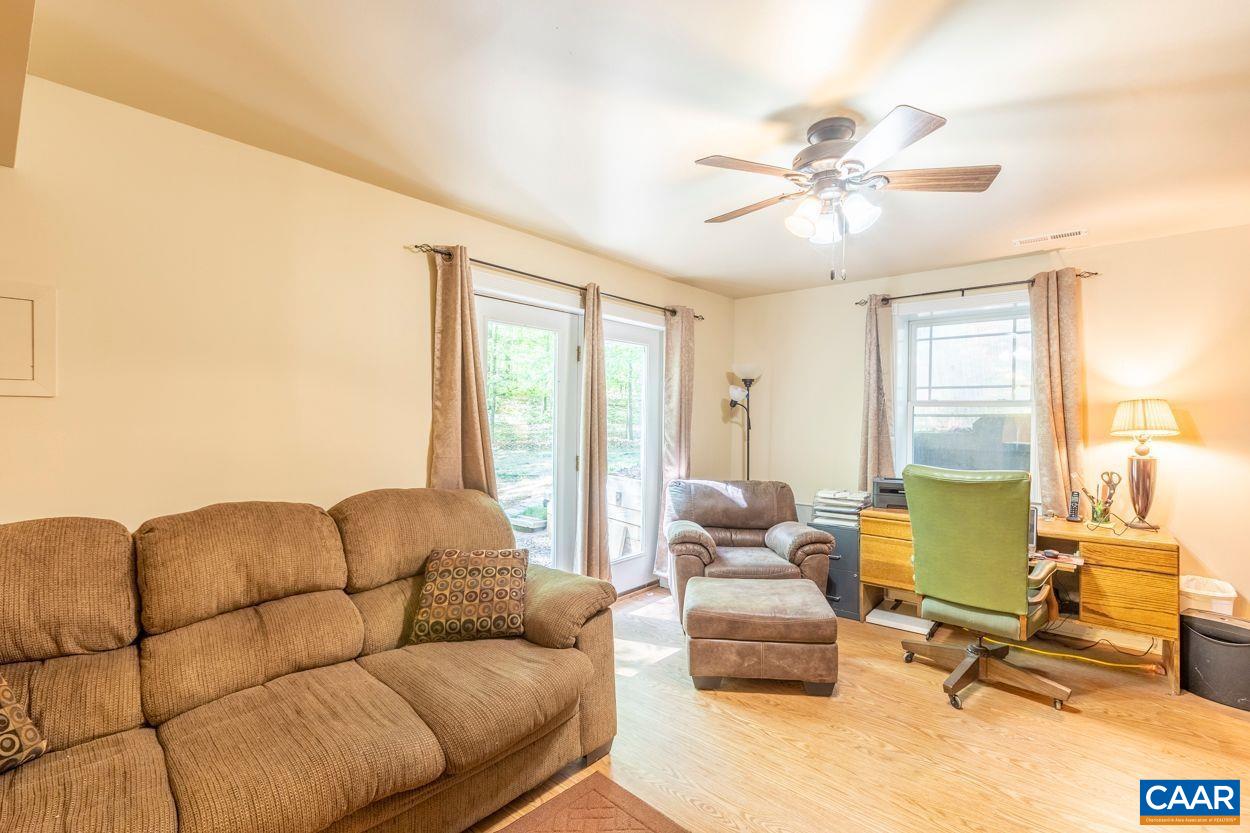6444 Spring Hill Road Ruckersville, VA 22968 - Photo 21 of 31 a living room with furniture and a large window