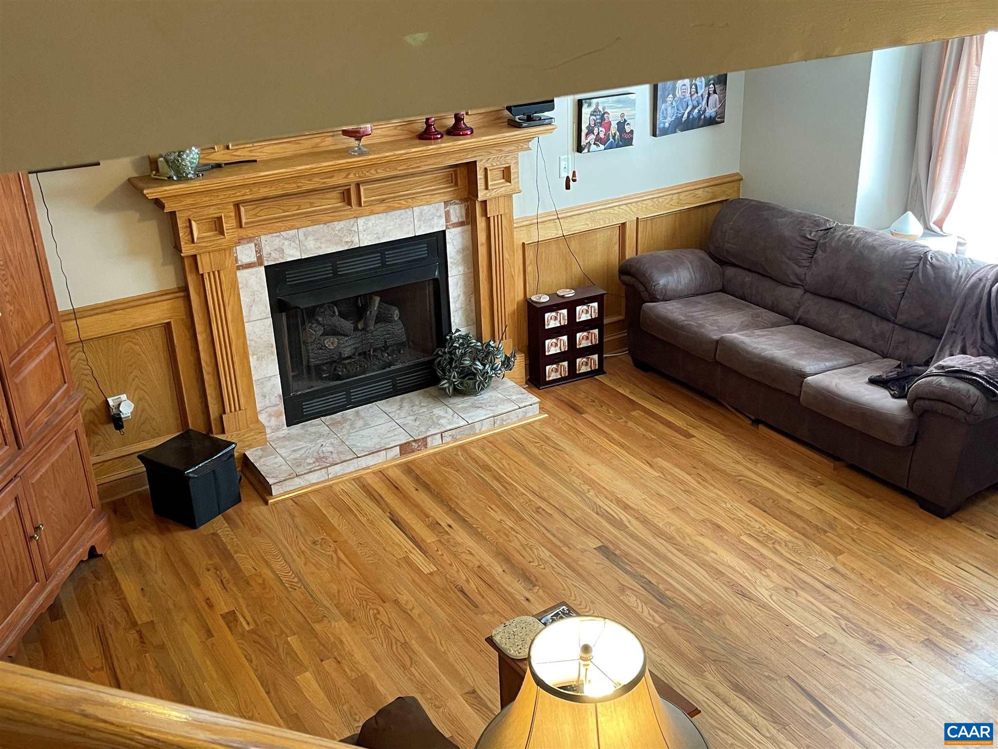 6444 Spring Hill Road Ruckersville, VA 22968 - Photo 5 of 31 a bedroom with a bed and a couch