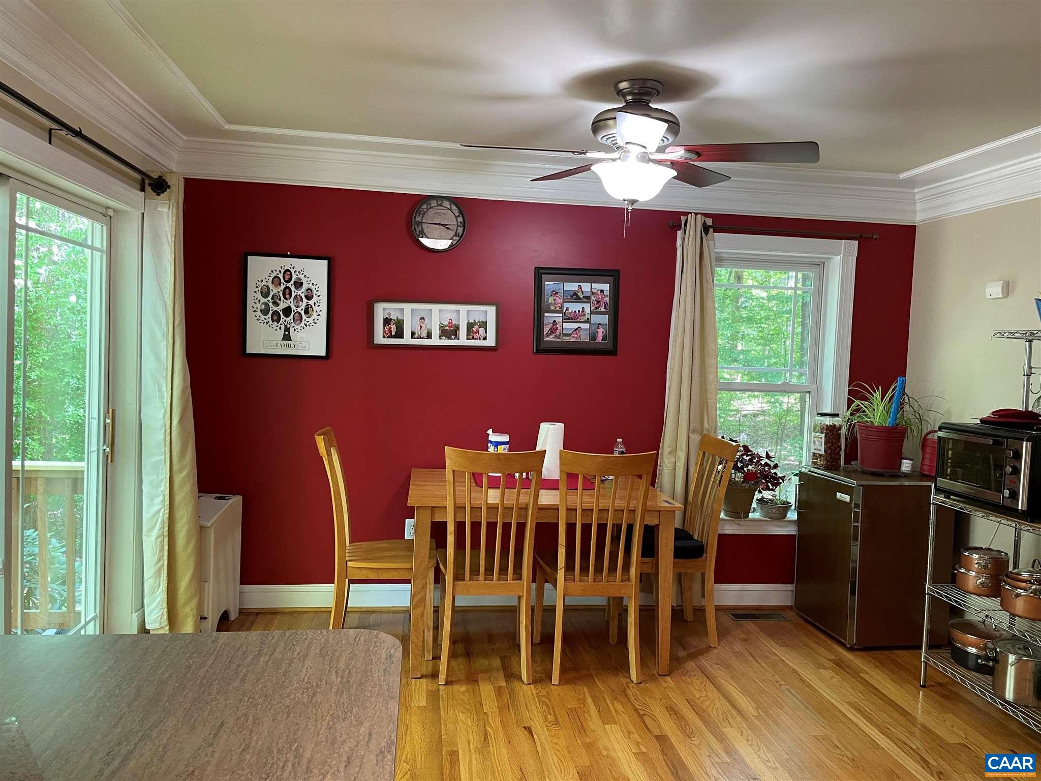 6444 Spring Hill Road Ruckersville, VA 22968 - Photo 6 of 31 a view of a dining room with furniture and chandelier