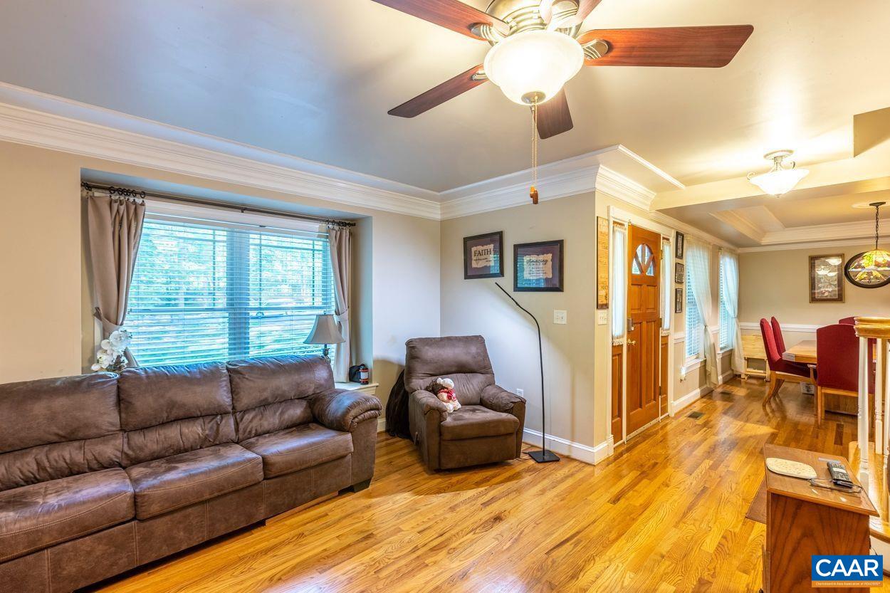 6444 Spring Hill Road Ruckersville, VA 22968 - Photo 7 of 31 a living room with furniture and a flat screen tv