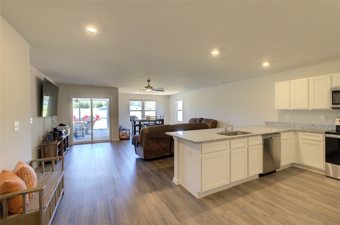 408 Chadwick Lane Walhalla, SC 29691 - Photo 40 of 44 An open floorplan seamlessly connects the kitchen to a spacious living area, ideal for entertaining.