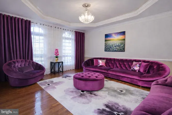 a dining room with furniture and a chandelier