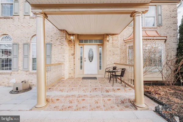 a bedroom with a bed and a window with wooden floor