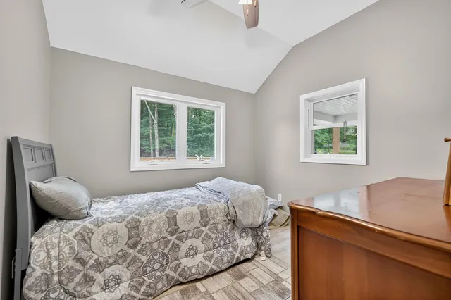 a bedroom with a bed and a closet