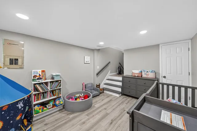 a bedroom with a bed and a dresser in it