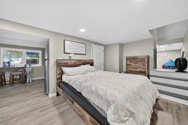 a living room with hard wood flooring and furniture