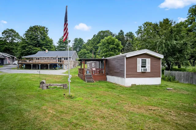 a house view with a sitting space and garden