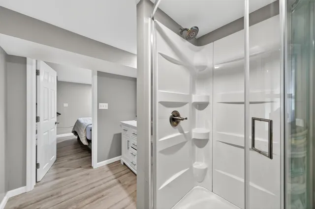 a kitchen with a table chairs refrigerator and microwave