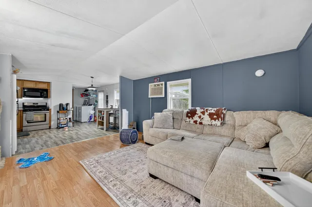 a view of a house with a yard and sitting area