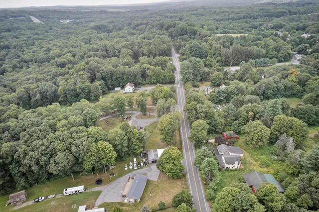 a view of a green field with lots of bushes