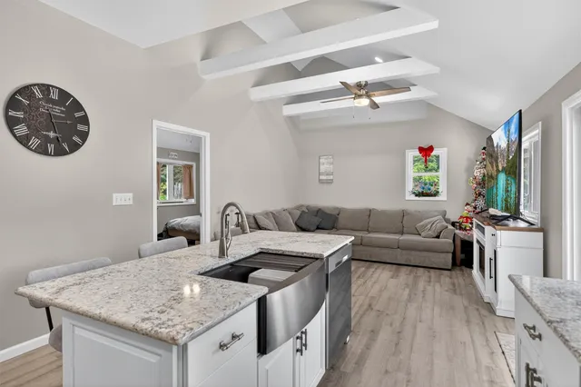 a view of a dirt road with trees in the background