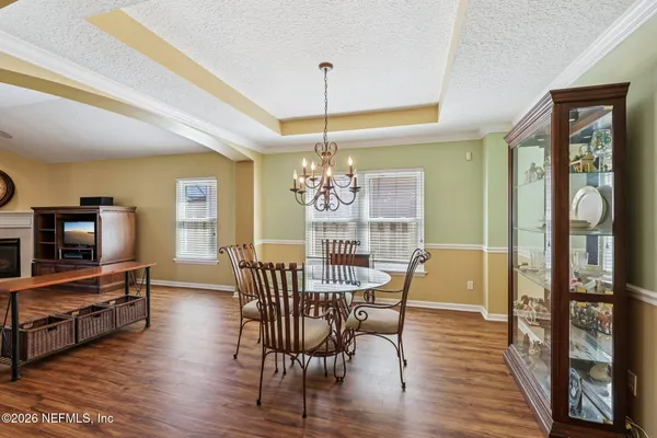 a view of a dining room with furniture window and wooden floor