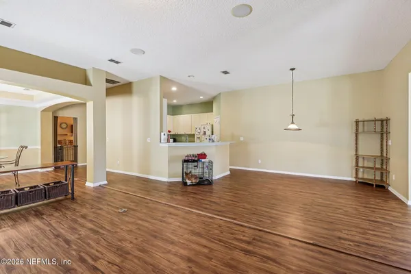 a kitchen with stainless steel appliances granite countertop a stove refrigerator sink and cabinets