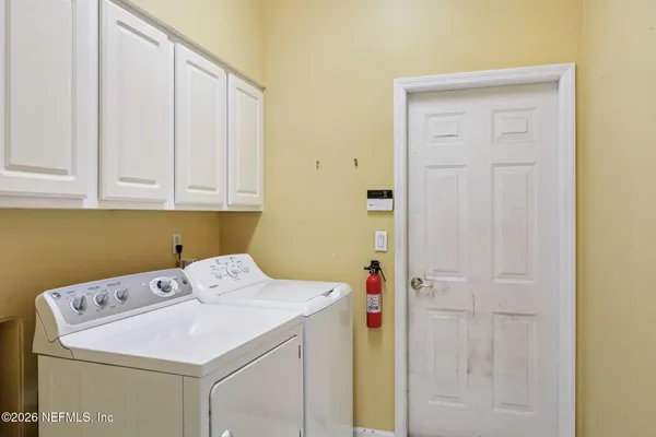 a room with furniture and wooden floor